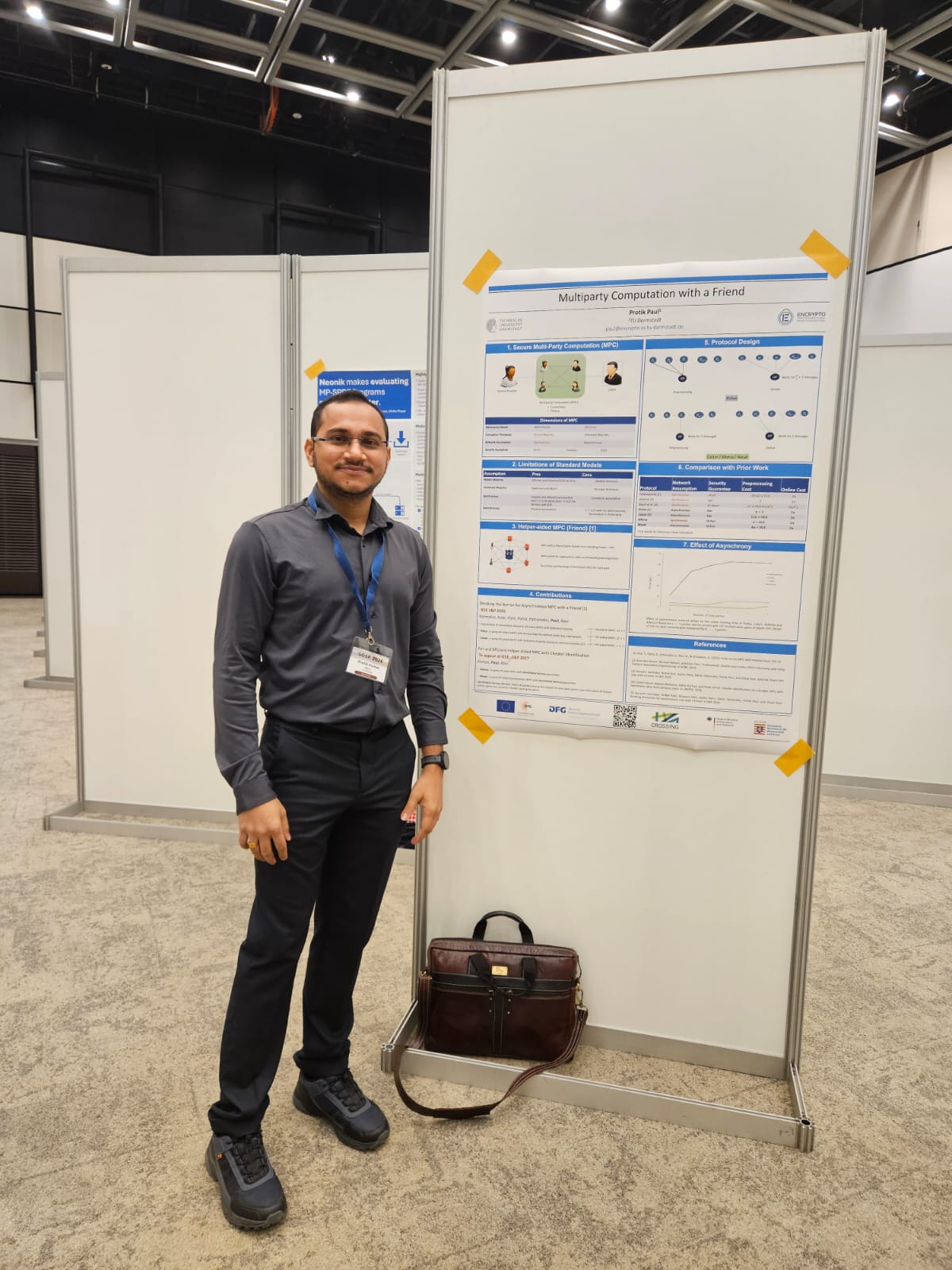Protik standing next to his poster Multiparty Computation with a Friend